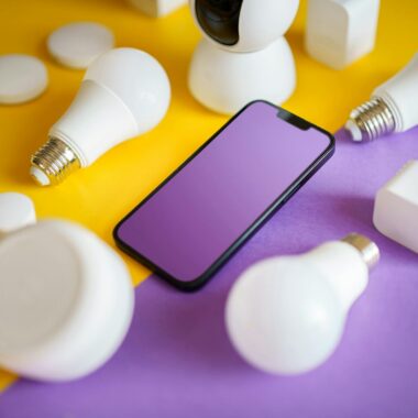 Photo by Jakub Zerdzicki Colorful flat lay of smart home devices and smartphone on vibrant background, ideal for technology concepts.